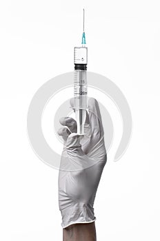 Doctor's hand holding a syringe, white-gloved hand, a large syringe, medical issue, the doctor makes an injection