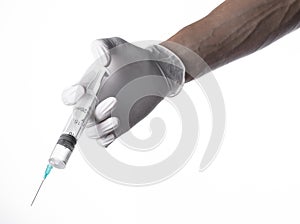 Doctor's hand holding a syringe, white-gloved hand, a large syringe, medical issue, the doctor makes an injection