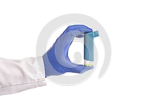 Doctor`s hand holds an inhaler from an attack of bronchial asthma on a white background, isolate. Concept of treatment and relief