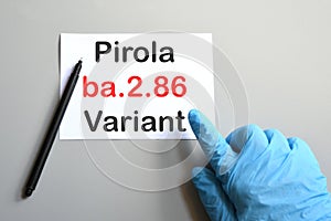 Doctor's hand indicate white sheet with text  ba.2.86 Pirola Variant.