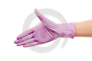 Doctor's hand in purple sterilized surgical glove giving for handshake