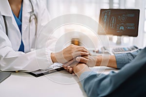 Doctor's hand reassuring elderly patient