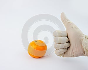 Doctor`s hand wearing gloves vitamin C immunity fighter thumbs upvirus, corona, covid-19, sars. mers, bacteria, germs