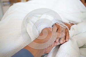 Doctor`s hands are encouraging the patient to have life support