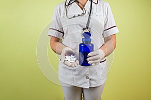 Doctor`s hands hold pills. Tablets or vitamins in the hands of a doctor