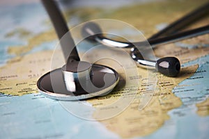 Doctor`s medical stethoscope over africa healthcheck