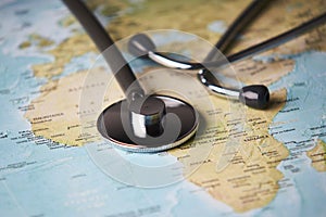 Doctor`s medical stethoscope over africa healthcheck