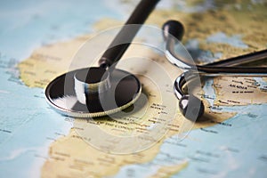 Doctor`s medical stethoscope over africa healthcheck