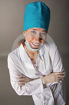 Doctor`s portrait. The woman the doctor in good mood. We wish a good health
