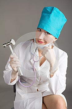 Doctor`s portrait. The woman the doctor in good mood. We wish a good health