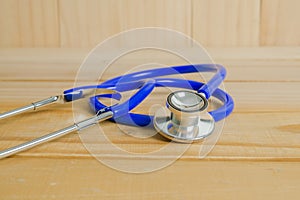 A doctor's stethoscope on wood background