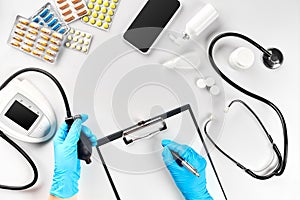 Doctor s table, tools, medical instruments, therapist tonometer, blood pressure, work in hospital on white background photo