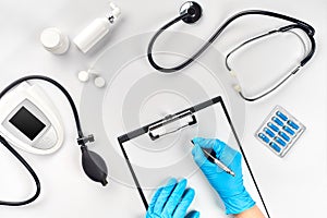 Doctor s table, tools, medical instruments, therapist tonometer, blood pressure, work in hospital on white background photo
