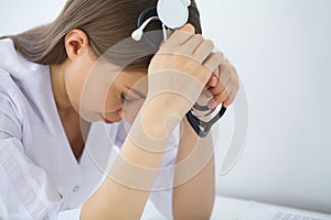 Doctor. Sad or crying female nurse at hospital office