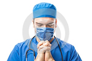 Doctor saying a prayer before surgery