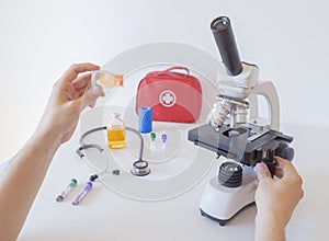 Doctor or Scientists are preparing samples to examine with a microscope in the medical laboratory