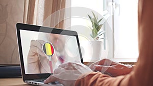 Doctor on the screen of computer and the stethoscope with flag of Belgium. Belgian telemedicine