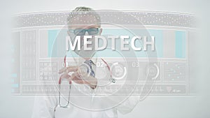 Doctor scrolls to MEDTECH tab on a modern medical display