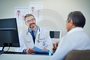 Doctor, senior man and office consultation for healthcare service, writing notes and listening to health problem