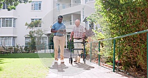 Doctor, senior man and walking frame in garden, tablet or talking for recovery at clinic. Medic, caregiver and person