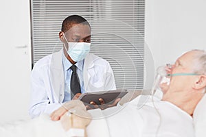 Doctor by Senior Patient in Hospital