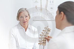 Doctor senior patient slipped disk