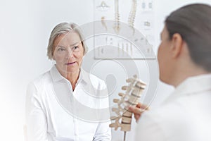 Doctor senior patient slipped disk photo