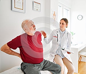 doctor senior patient woman medical hospital health care man medicine office clinic healthcare elderly back pain