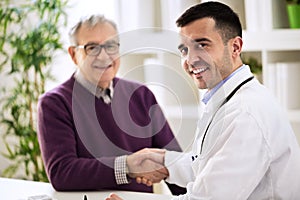 Doctor shakes hands with a patient