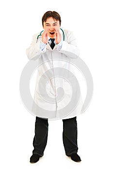 Doctor shouting through megaphone shaped hands