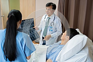 Doctor show Film X-ray for a patient at hospital. Body scan after surgery and operate. Health