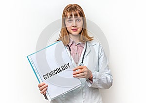 Doctor showing clipboard with written text: Gynecology photo