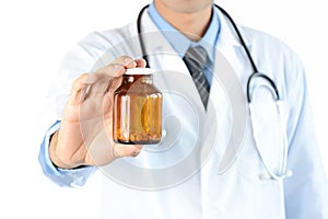 Doctor showing drug or medicine bottle