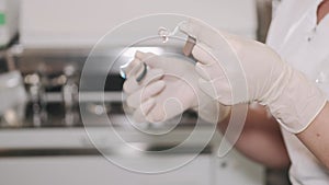 Doctor showing hearing aid to female patient