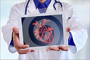 Doctor showing a heart on a tablet in front closeup
