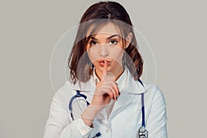 Doctor showing hush sign gesture with hand