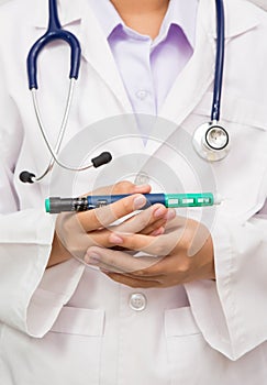 Doctor showing insulin pen