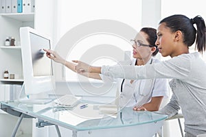 Doctor showing patient results on the computer