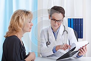 Doctor showing patient test results