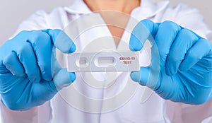 Doctor showing rapid laboratory COVID-19 antigen rapid test for diagnosis new Corona virus infection or covid-19 Pandemic