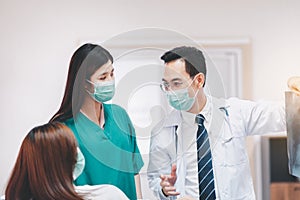 Doctor showing X-ray film results to woman patient,Infertility counseling and suggestion using new ivf technology