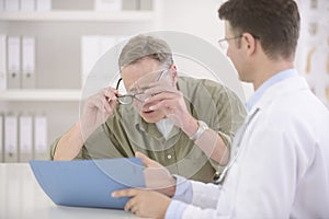 Doctor showing results to myopic patient