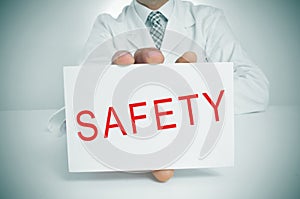 Doctor showing a signboard with the word safety photo