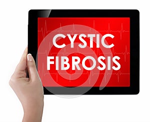 Doctor showing tablet with CYSTIC FIBROSIS text. photo