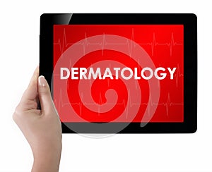 Doctor showing tablet with DERMATOLOGY text. photo