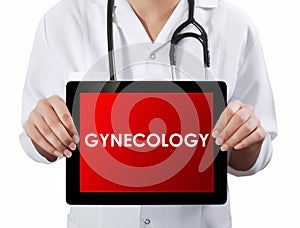 Doctor showing tablet with GYNECOLOGY text. photo
