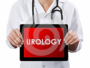 Doctor showing tablet with UROLOGY text. photo