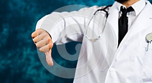 Doctor showing thumbs down close up