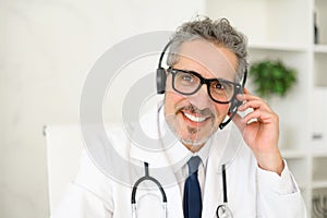 The doctor is shown in a telehealth setting, cheerfully engaging with a patient online at a distance