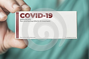 Doctor shows a box of coronavirus covid-19 antiviral pills